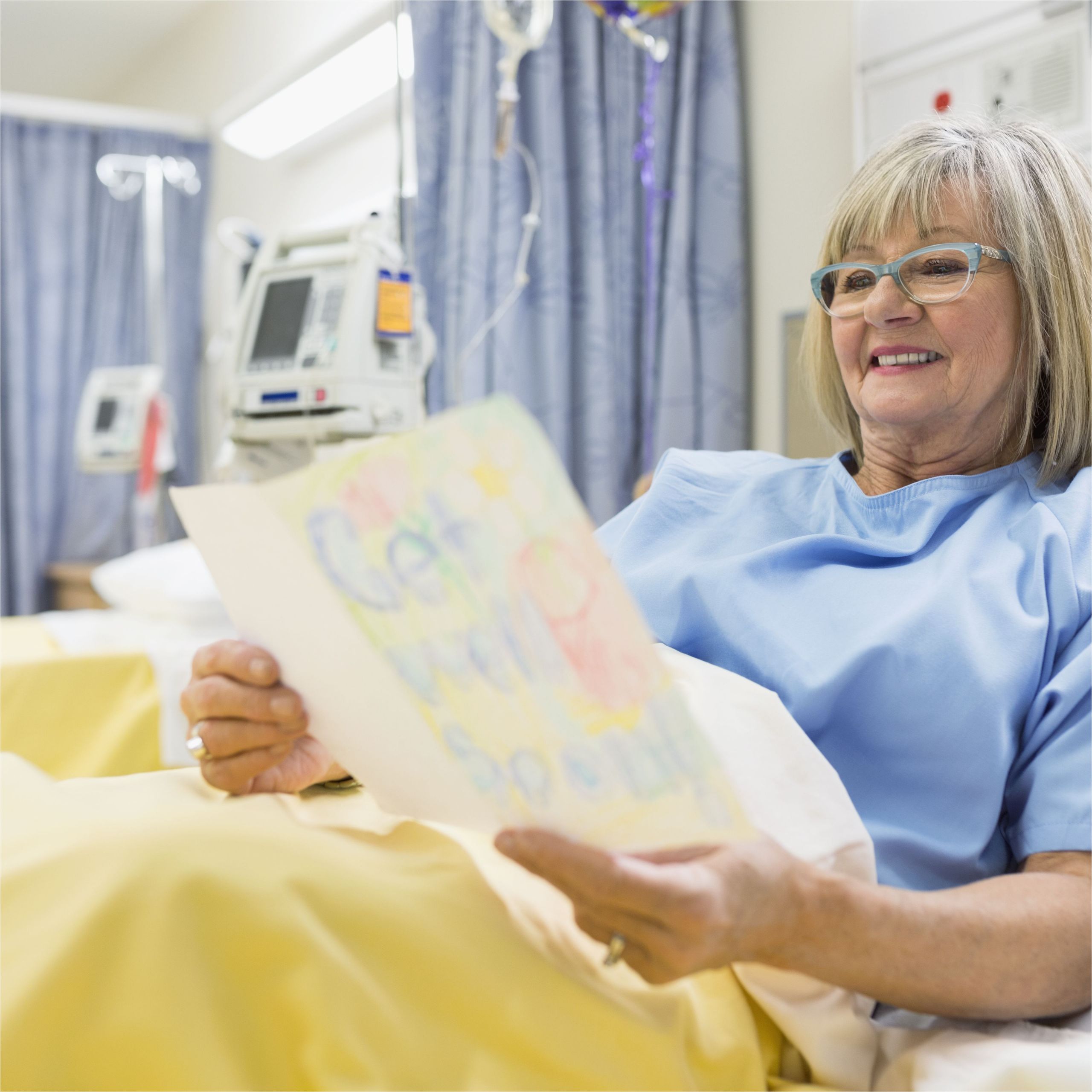 senior woman reading get well card in hospital 536907203 5bc4b64fc9e77c00514bb8d2 jpg