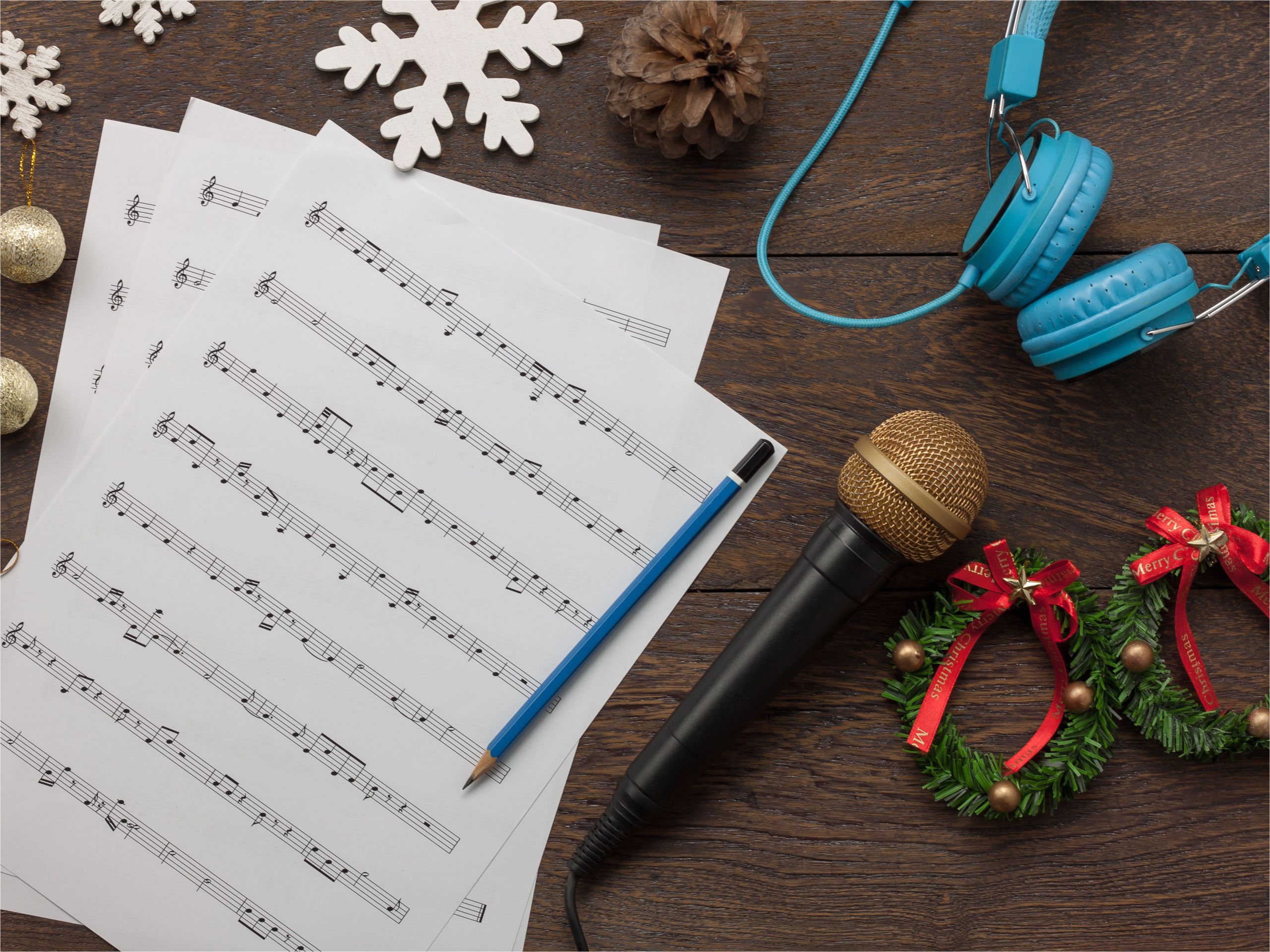 table top view of music sheet note and accessories merry christmas happy new year concept instrument musical with decoration festive on the modern rustic dark brown wooden at home office desk 865548576 0c8520ffa2904d06a2b2eb04edc379d2 jpg